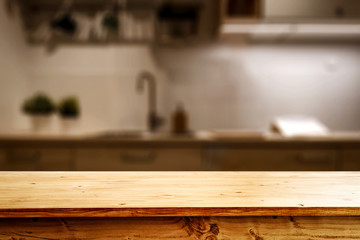 Wooden desk of free space and kitchen interior 