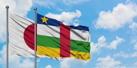 Japan and Central African Republic flag waving in the wind against white cloudy blue sky together. Diplomacy concept, international relations.