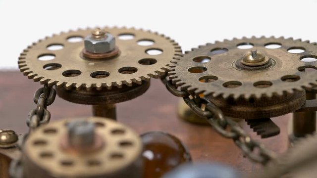 close-up spinning gears, Very similar to a clock mechanism or a working device in the old style. 4K