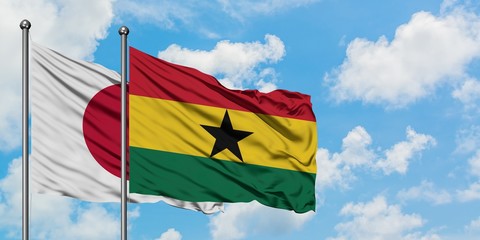 Japan and Ghana flag waving in the wind against white cloudy blue sky together. Diplomacy concept,...