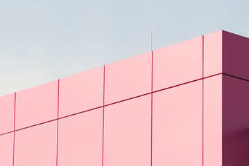 Geometric color elements of the building facade with planes, lines, corners with highlights and reflections for the abstract background and texture of pink, lilac, blue colors. Place for text
