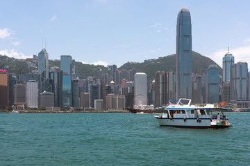 Fototapeta premium Victoria Harbour, Hong Kong. A view of the famous Hong Kong island Central business district from Kowloon across the Victoria harbour. 