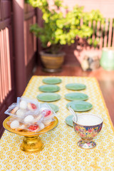 Offer food to monk. Groom give alms food to a Buddhist monk in traditional thai wedding ceremony. Hand while put food offerings in a Buddhist monk's alms bowl.Buddhists offer food in bowls.