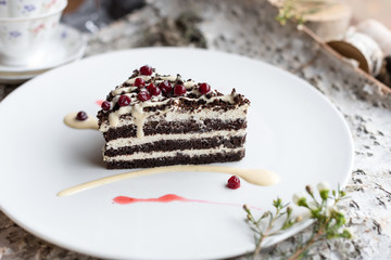 Dark Chocolate Layered Cake with Butter Cream and Lingonberry Decoration