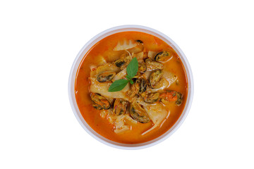 Coconut Milk Curry with bamboo shoot and green mussel in bowl on wood table isolated on white background