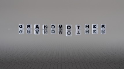 The concept of grandmother represented by black and white plastic letter cubes