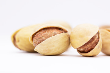 pistachios on a white background. dried nuts close up