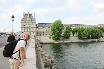 France, Paris - June 17, 2011: People walking in front of famous Louvre museum