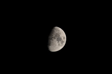 half moon in the dark sky