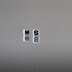 The concept of Ms. represented by wooden letter tiles