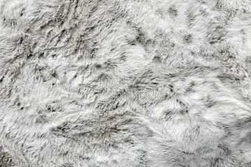 Soft and Cozy Faux Fur Textured White and Grey Blanket Background