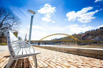 Bench in Roberto Clemente Memorial Park near river