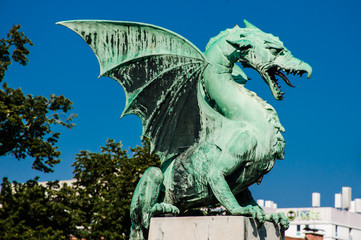 Ljubljana Dragon over the dragon Bridge with side view. Slovenia. European destination. Blue sky Background. 