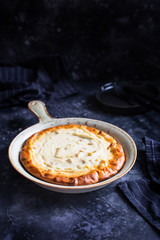 Homemade cheesecake, Russian cheesecake, homemade cottage cheese casserole with raisins. On a ceramic decorative dish