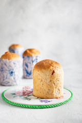 Homemade Easter cakes in paper wrapper. Light background