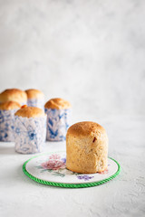 Homemade Easter cakes in paper wrapper. Light background