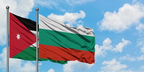 Jordan and Bulgaria flag waving in the wind against white cloudy blue sky together. Diplomacy concept, international relations.