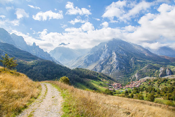 Naklejka premium Peaks of Europe. View from the mountain change, on the left the orange tree of the bulnes and on the right the town of Sotres.
