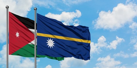 Jordan and Nauru flag waving in the wind against white cloudy blue sky together. Diplomacy concept, international relations.