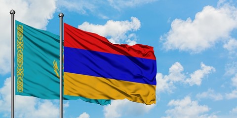Kazakhstan and Armenia flag waving in the wind against white cloudy blue sky together. Diplomacy concept, international relations.
