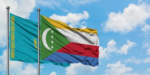 Kazakhstan and Comoros flag waving in the wind against white cloudy blue sky together. Diplomacy concept, international relations.