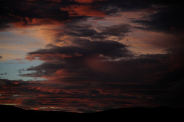 Fototapeta premium Storm clouds in the light of dawn on a dawn of early spring days. Vitoria-Gasteiz (Alava) Basque Country, Spain