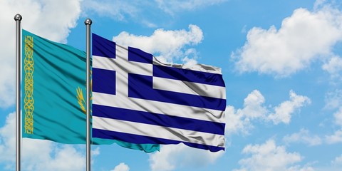 Kazakhstan and Greece flag waving in the wind against white cloudy blue sky together. Diplomacy concept, international relations.