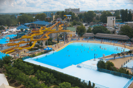 View of the pool in the water park from a height. bird flight. It's a nasty day. Summer holiday concept