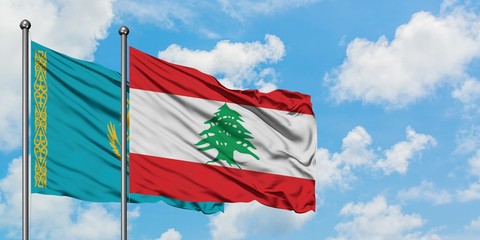 Kazakhstan and Lebanon flag waving in the wind against white cloudy blue sky together. Diplomacy concept, international relations.