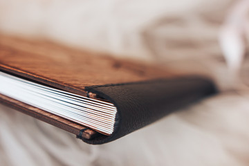 Leather binding of a wooden photo book. Leather binding photo book made of wood. Note book with...