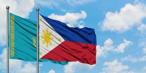 Kazakhstan and Philippines flag waving in the wind against white cloudy blue sky together. Diplomacy concept, international relations.
