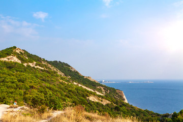 Evening over a high and steep seashore.