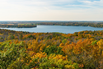 Aerial view of a lake with colorful trees
