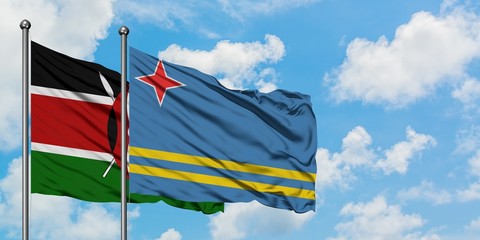 Kenya and Aruba flag waving in the wind against white cloudy blue sky together. Diplomacy concept, international relations.