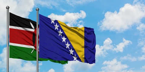 Kenya and Bosnia Herzegovina flag waving in the wind against white cloudy blue sky together. Diplomacy concept, international relations.