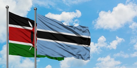 Kenya and Botswana flag waving in the wind against white cloudy blue sky together. Diplomacy concept, international relations.