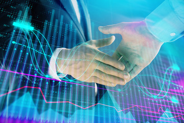 Multi exposure of forex graph on abstract background with two businessmen handshake. Concept of success on stock market