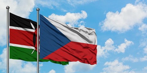 Kenya and Czech Republic flag waving in the wind against white cloudy blue sky together. Diplomacy...