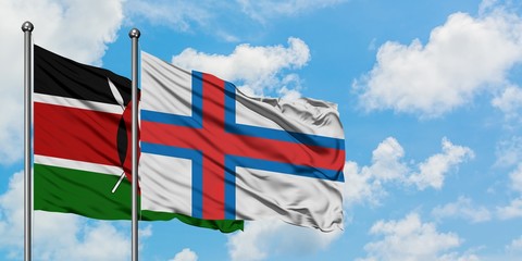Kenya and Faroe Islands flag waving in the wind against white cloudy blue sky together. Diplomacy...