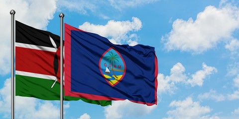Kenya and Guam flag waving in the wind against white cloudy blue sky together. Diplomacy concept, international relations.