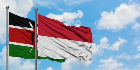 Kenya and Indonesia flag waving in the wind against white cloudy blue sky together. Diplomacy concept, international relations.