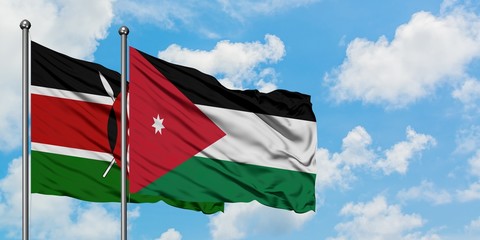 Kenya and Jordan flag waving in the wind against white cloudy blue sky together. Diplomacy concept, international relations.