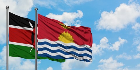 Kenya and Kiribati flag waving in the wind against white cloudy blue sky together. Diplomacy...