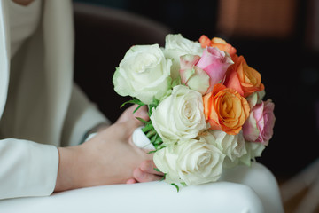 Wedding bouquet in bride's  hands