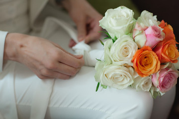 Wedding bouquet in bride's  hands