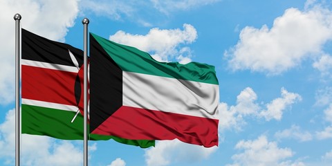 Kenya and Kuwait flag waving in the wind against white cloudy blue sky together. Diplomacy concept, international relations.