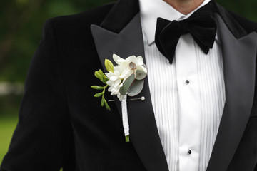 Groom with flower boutonniere on wedding day