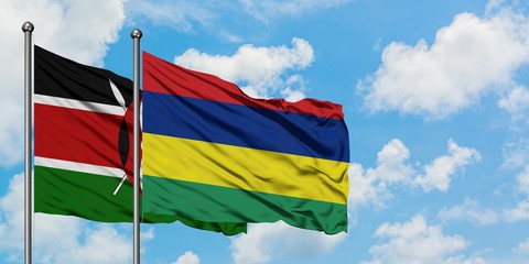 Kenya and Mauritius flag waving in the wind against white cloudy blue sky together. Diplomacy...