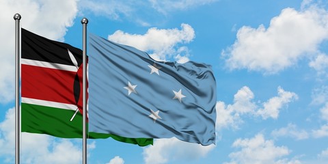 Kenya and Micronesia flag waving in the wind against white cloudy blue sky together. Diplomacy...