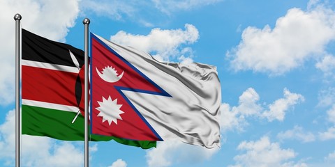 Kenya and Nepal flag waving in the wind against white cloudy blue sky together. Diplomacy concept, international relations.